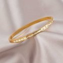 Troli Elegant gold-plated solid bracelet with crystals Troli Elegant gold-plated solid bracelet with crystals