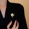 Shiny flower brooch with artificial pearl, gold Shiny flower brooch with artificial pearl, gold